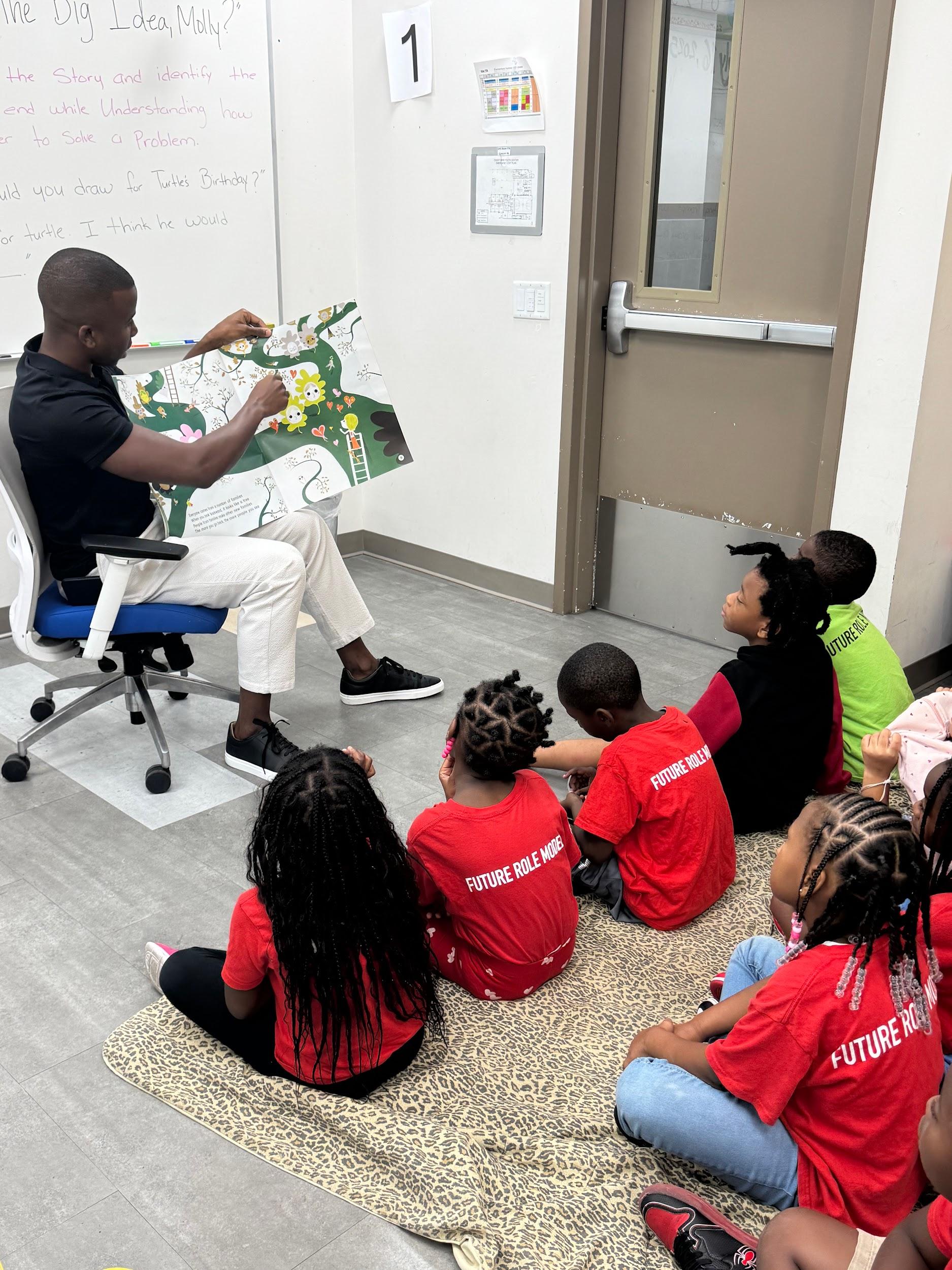 Kendrick Meek reading to children at a community program