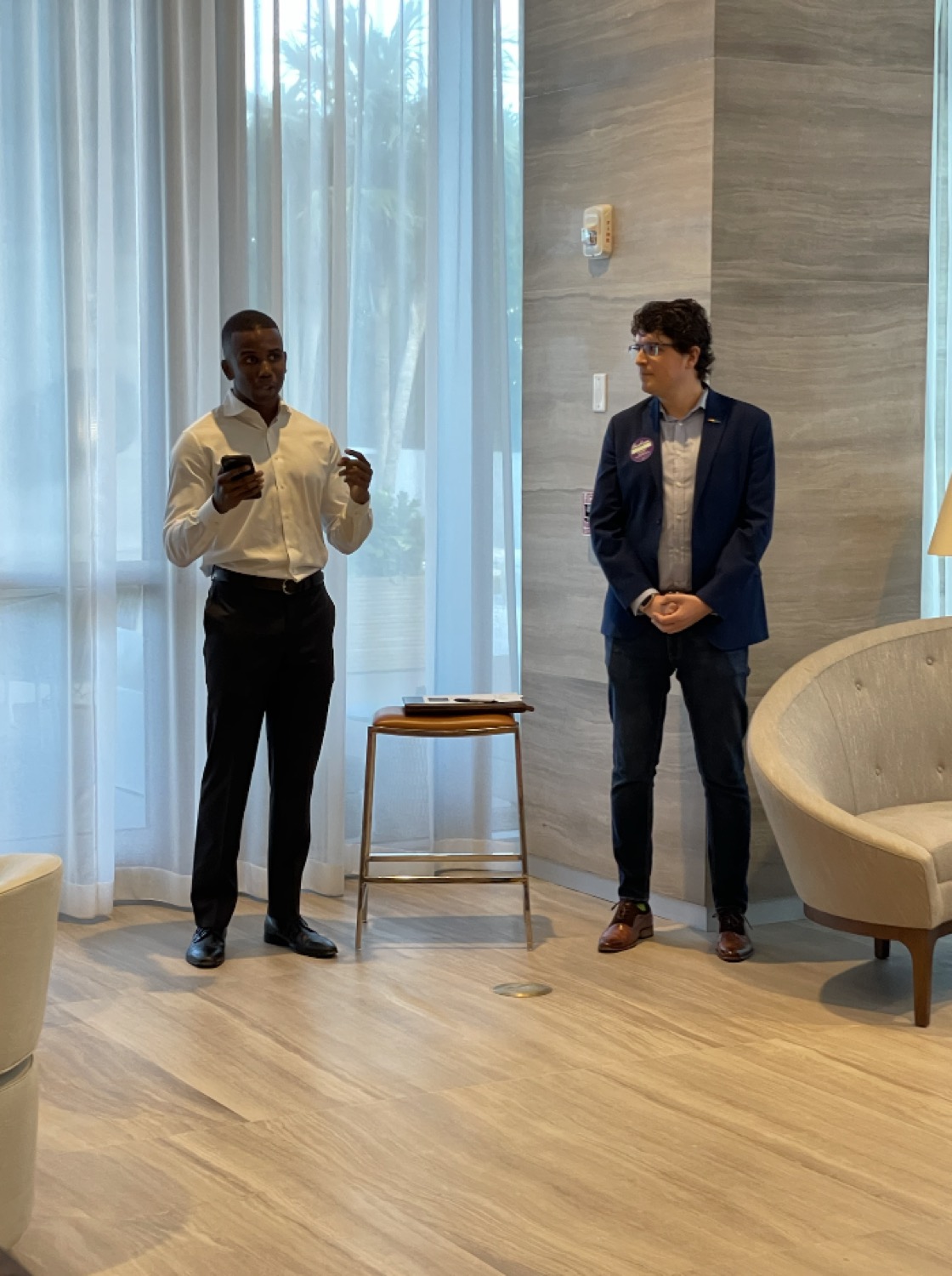 Kendrick Meek speaking with a supporter at a campaign event